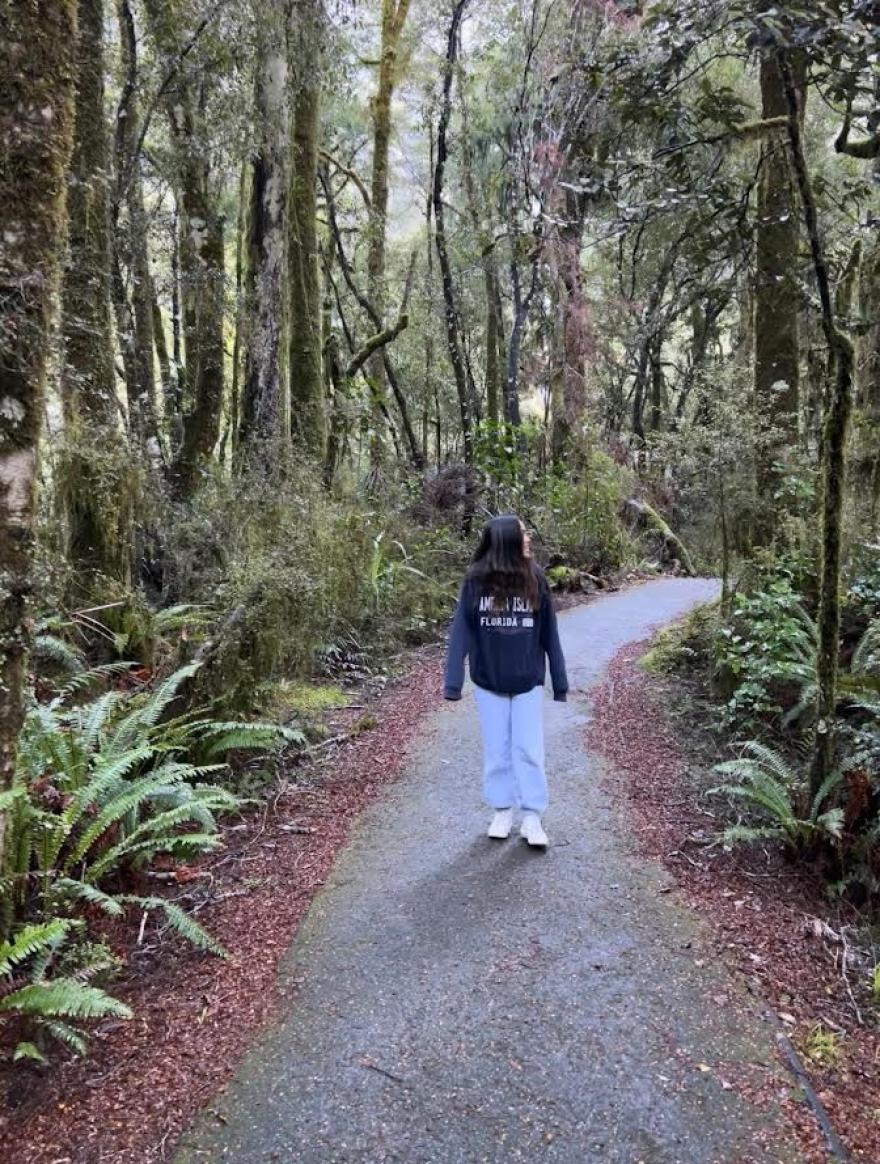 Bethany Spencer on a casual walk amongst a forest. 